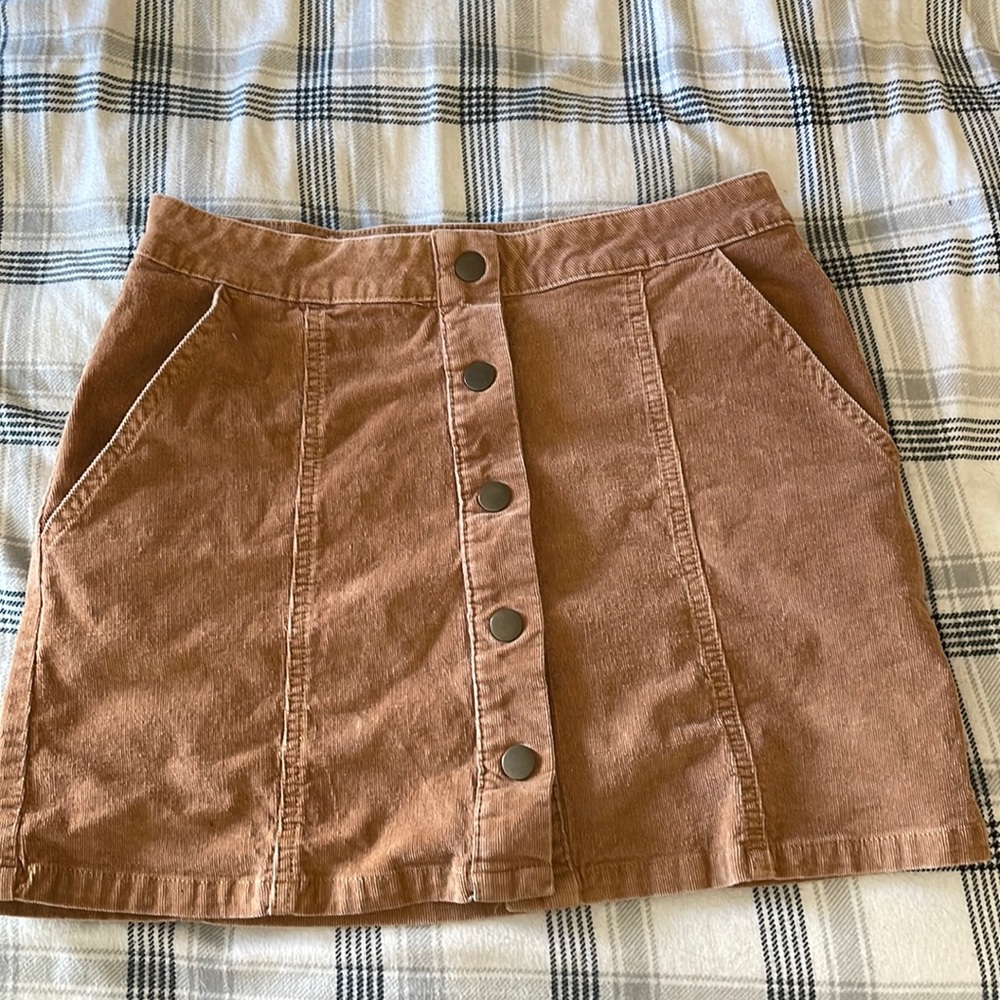 Button mini skirt size small. Excellent condition. Stretchy & slimming